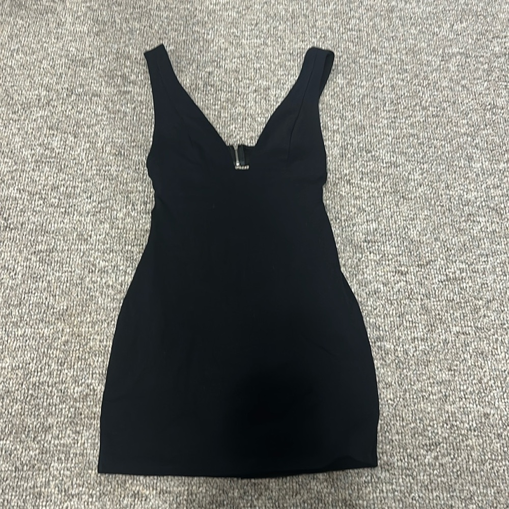 Size small Little Black Dress.Very sliming & sexy.Zipper back.Opening mid back.